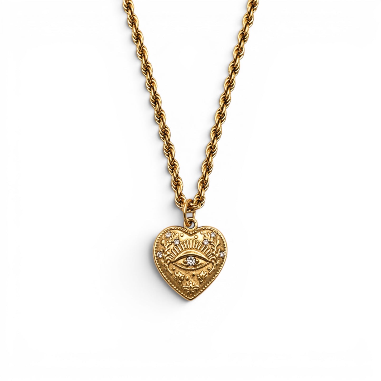 Gold heart pendant with a crystal-set eye at its centre on a rope chain