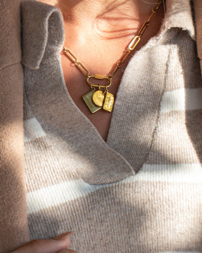 Rich Tea Biscuit Charm worn on a clasp chain with Malted Milk and Bourbon, striped knit